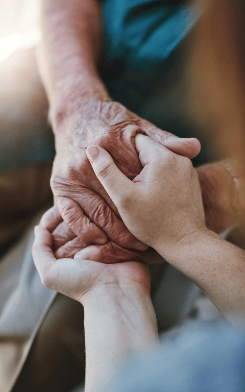 Younger hands embraced with older hands